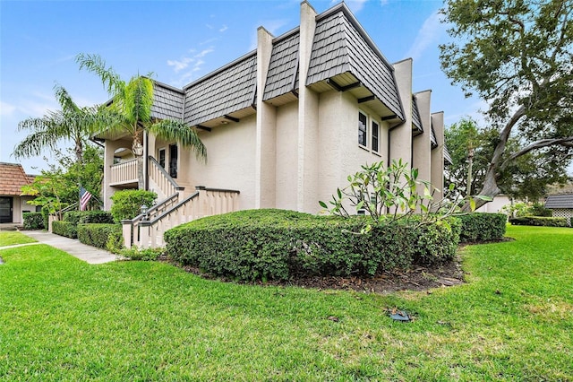 view of property exterior featuring a lawn