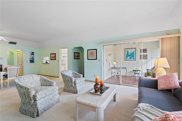 living room with ceiling fan and light carpet