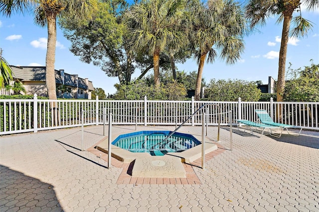 view of pool featuring a patio area and a community hot tub