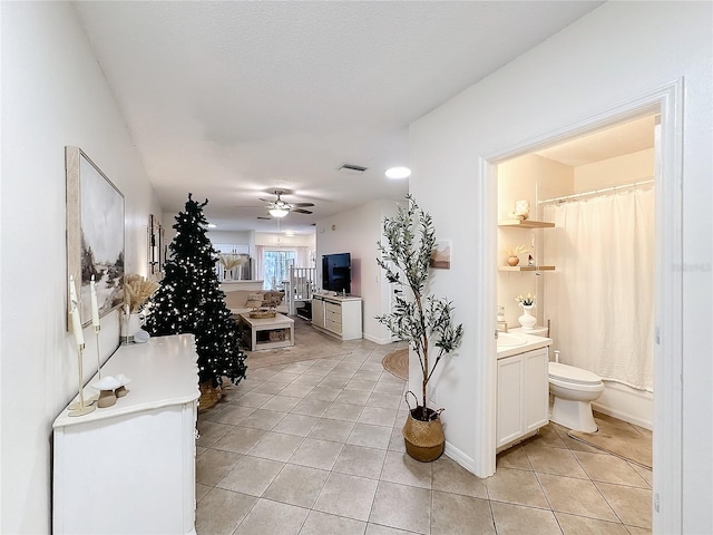 hall with light tile patterned flooring