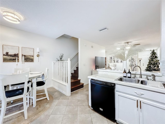 kitchen featuring ceiling fan, dishwasher, sink, light tile patterned floors, and white cabinets