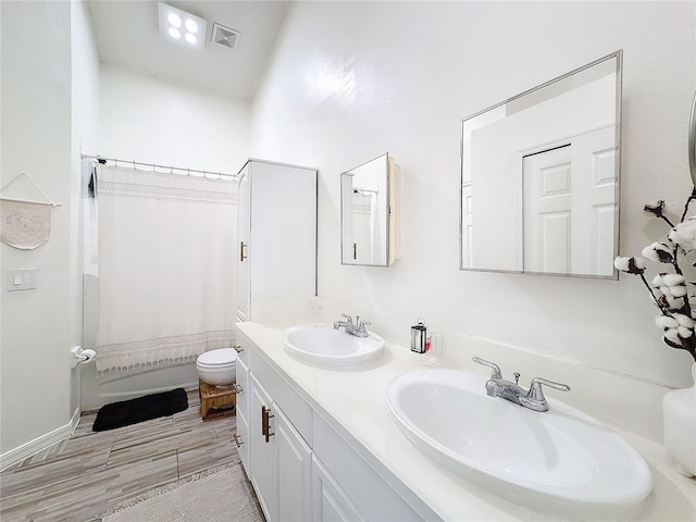 full bathroom with shower / tub combo, vanity, toilet, and wood-type flooring