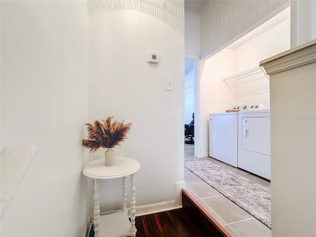 laundry area featuring washer and dryer and hardwood / wood-style flooring