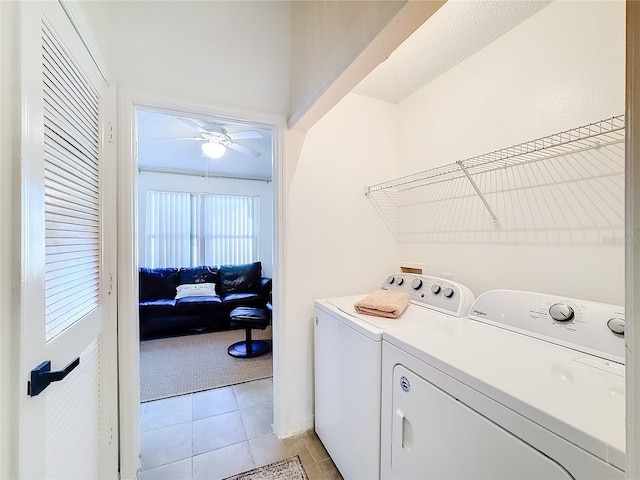 clothes washing area with separate washer and dryer, ceiling fan, and light colored carpet