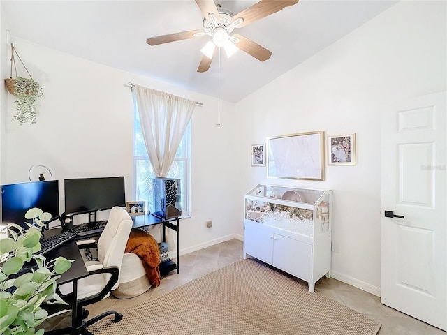 tiled office space featuring ceiling fan and vaulted ceiling