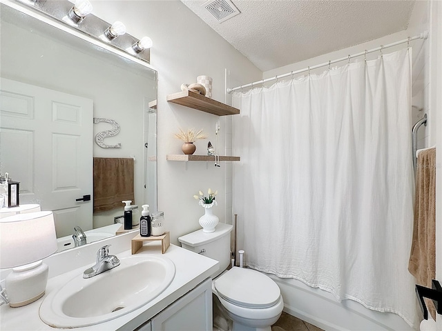 full bathroom with shower / tub combo, vanity, a textured ceiling, and toilet