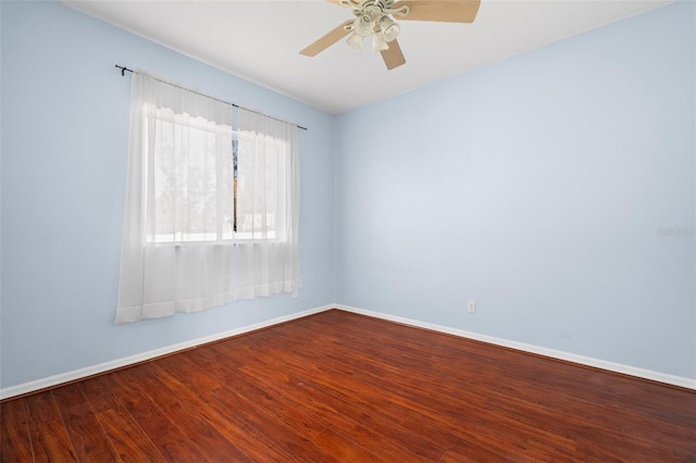 spare room with ceiling fan and wood-type flooring