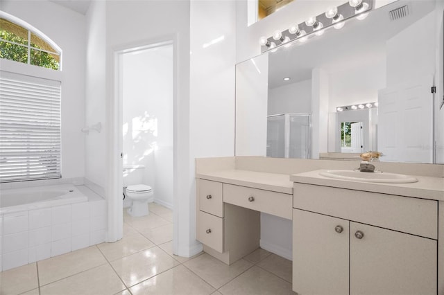 full bathroom featuring tile patterned floors, vanity, toilet, and plus walk in shower