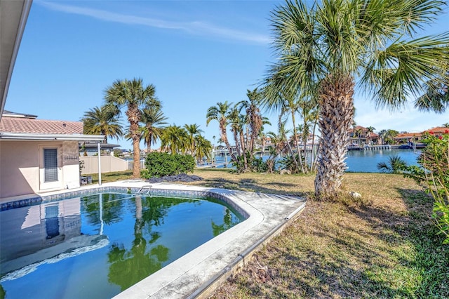 view of swimming pool with a water view