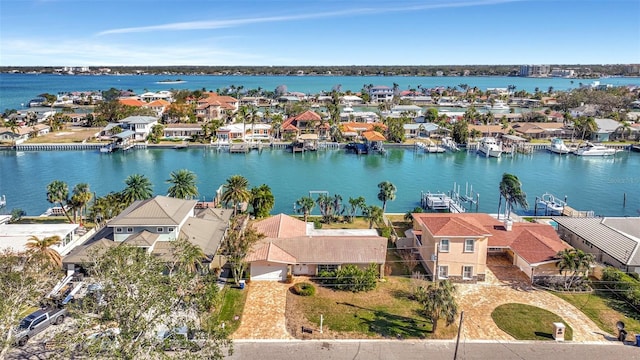 birds eye view of property with a water view