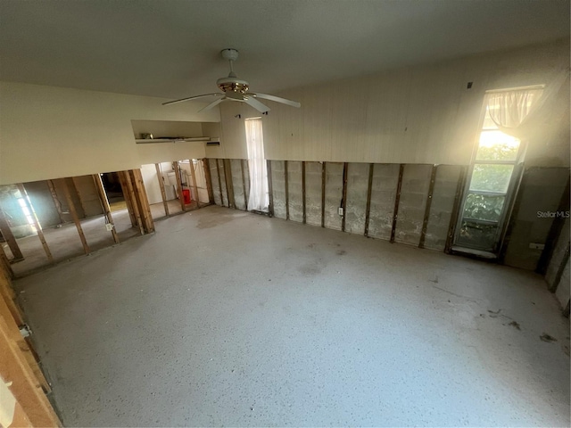 basement with ceiling fan