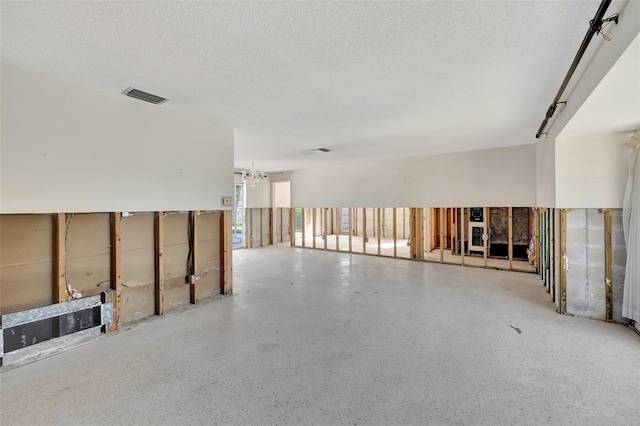 spare room featuring a textured ceiling