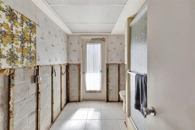 bathroom with tile patterned flooring and toilet