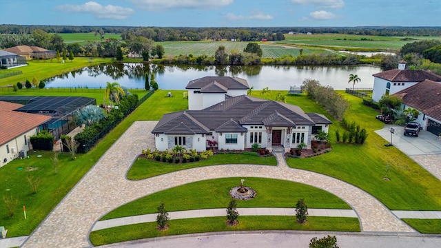 birds eye view of property featuring a water view