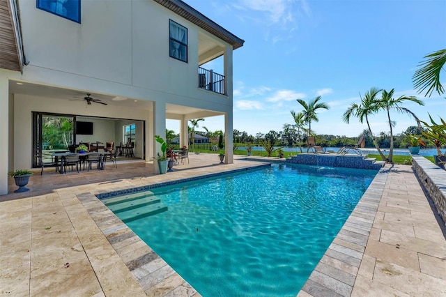 view of pool featuring a patio area, pool water feature, and ceiling fan