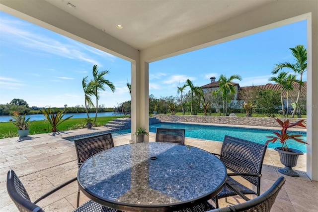 view of patio with a water view