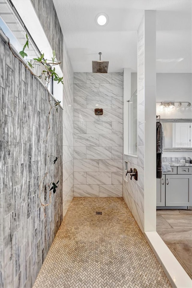 bathroom with a tile shower