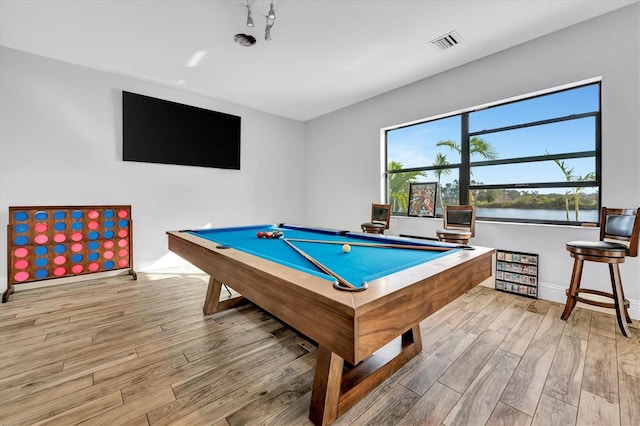 game room with light hardwood / wood-style floors and pool table