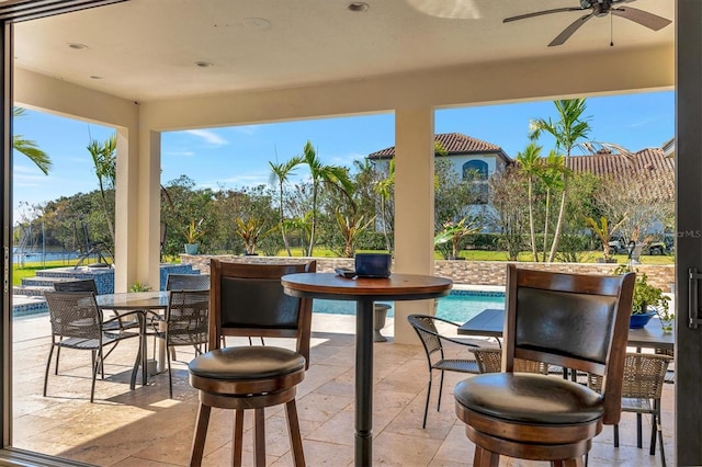 view of patio with ceiling fan