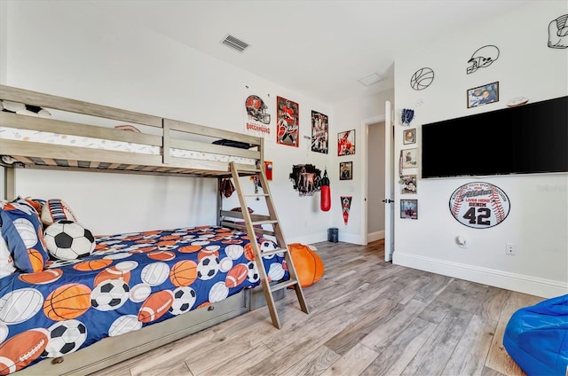 bedroom with light hardwood / wood-style flooring