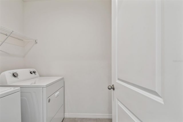 laundry room with separate washer and dryer