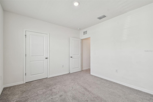 unfurnished bedroom with light carpet