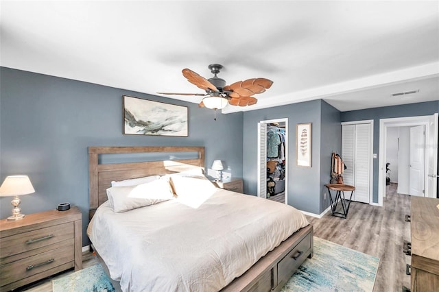 bedroom featuring light hardwood / wood-style floors and ceiling fan