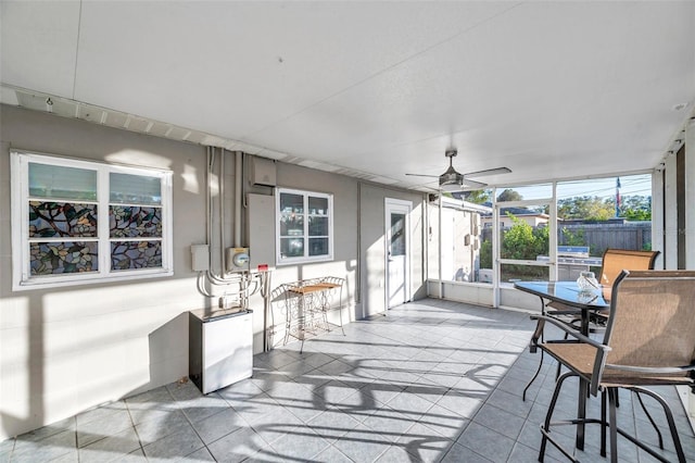 sunroom / solarium with ceiling fan