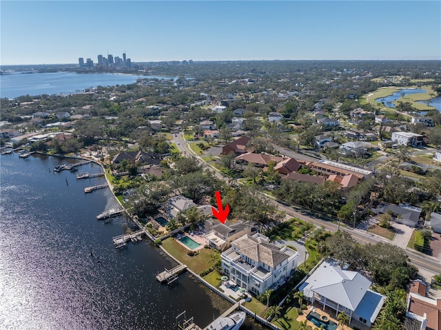 birds eye view of property with a water view