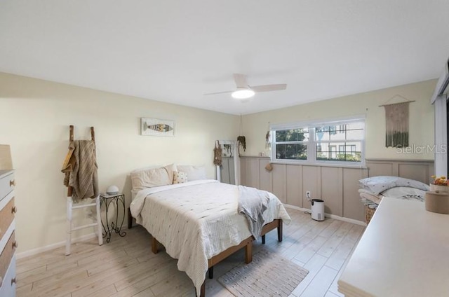 bedroom featuring light hardwood / wood-style flooring and ceiling fan