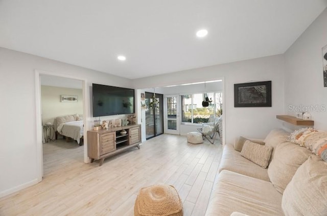 living room with light hardwood / wood-style flooring