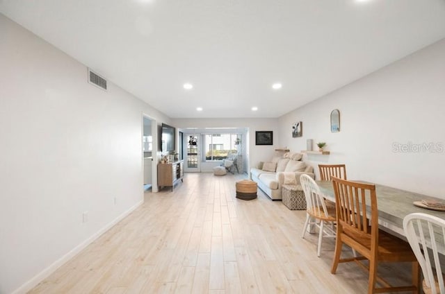 living room with light hardwood / wood-style floors