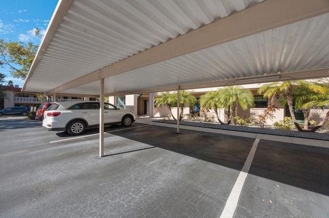 view of parking / parking lot with a carport