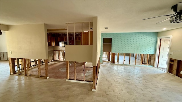 interior space featuring ceiling fan