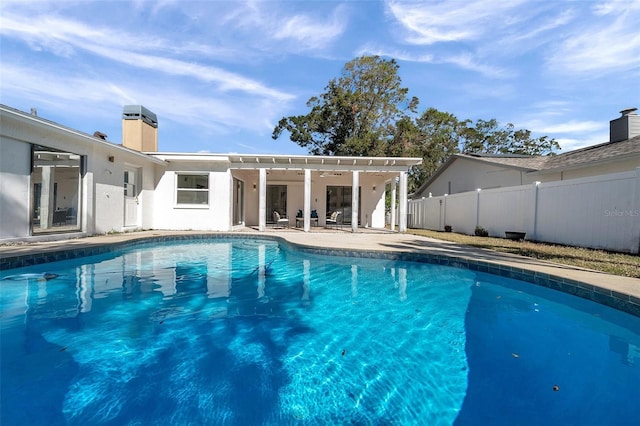 view of swimming pool with a patio area