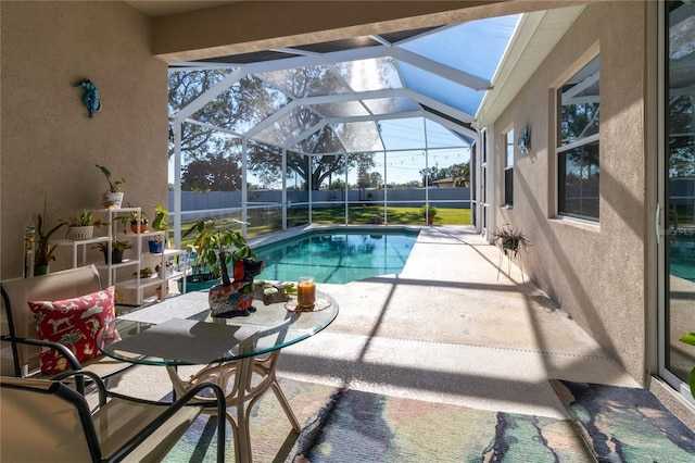 view of swimming pool featuring a fenced in pool, a patio area, glass enclosure, and fence