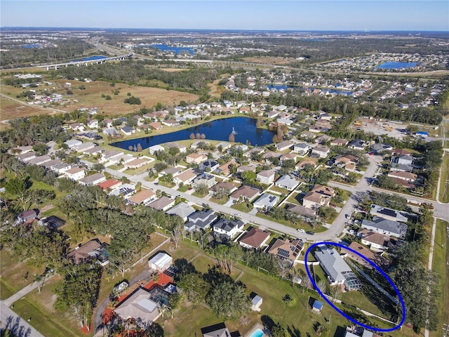 bird's eye view featuring a water view and a residential view