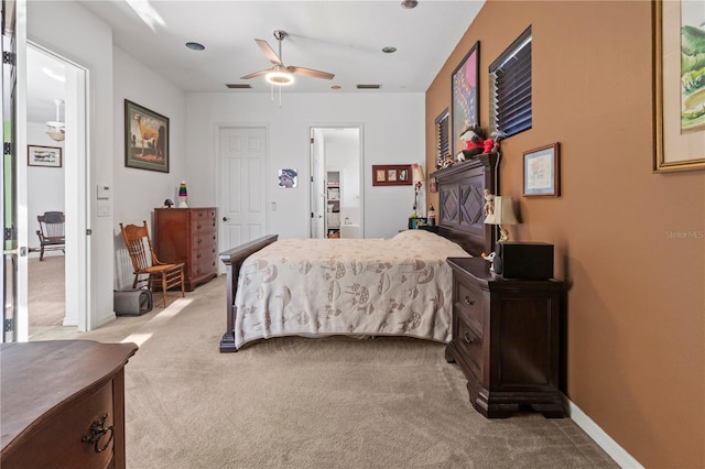 bedroom with light carpet, a ceiling fan, and baseboards