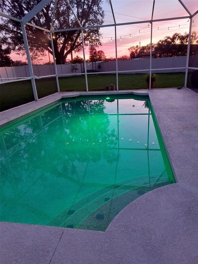 view of pool featuring a fenced in pool, a yard, a patio, glass enclosure, and fence