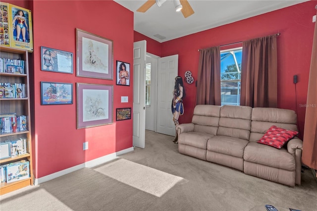 living area featuring light carpet, visible vents, baseboards, and a ceiling fan