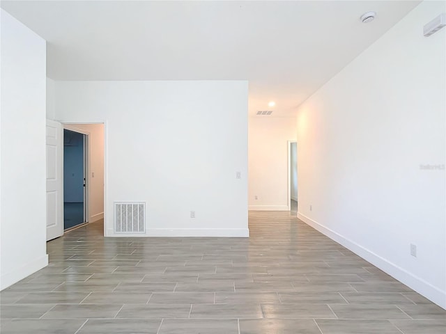 spare room featuring light wood-type flooring