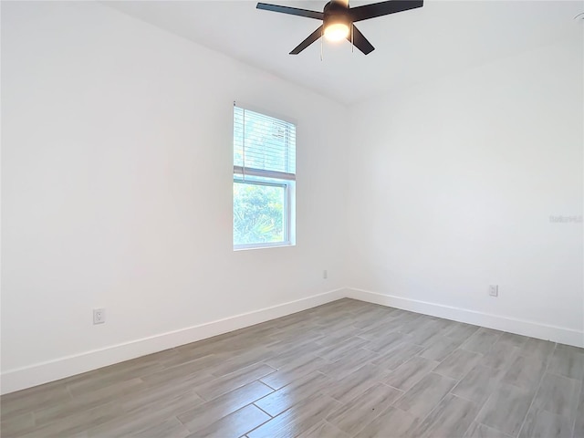 spare room featuring ceiling fan and light hardwood / wood-style floors