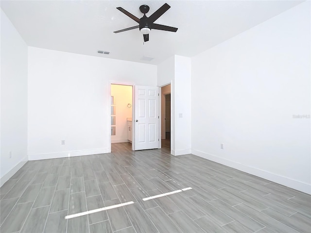 unfurnished room featuring light hardwood / wood-style flooring and ceiling fan