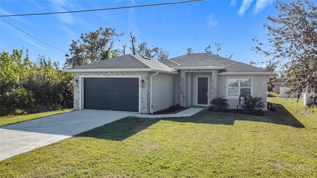 view of front of property featuring a front yard and a garage