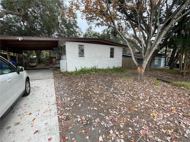 view of home's exterior featuring a carport