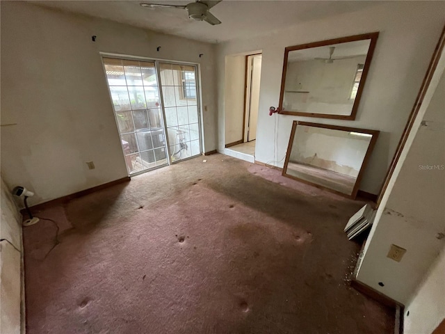 interior space featuring ceiling fan and light carpet