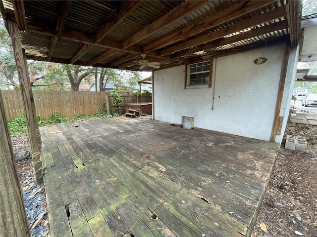 wooden deck featuring ceiling fan