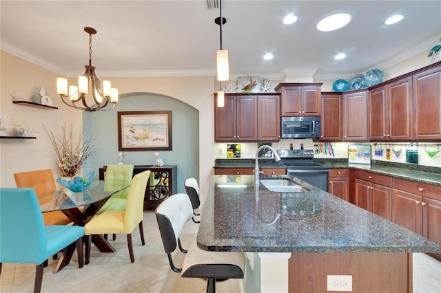 kitchen with crown molding, pendant lighting, stainless steel appliances, and an inviting chandelier