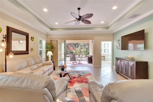 living room featuring ornamental molding, ceiling fan, a healthy amount of sunlight, and light tile patterned flooring