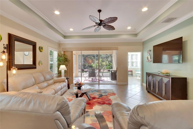 tiled living room featuring a wealth of natural light, ornamental molding, and ceiling fan